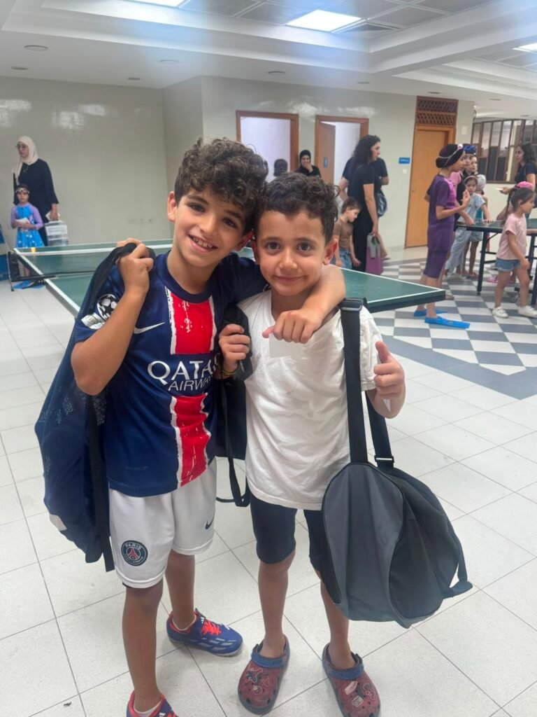 Two young De La Salle swimmers celebrating together after the competition.